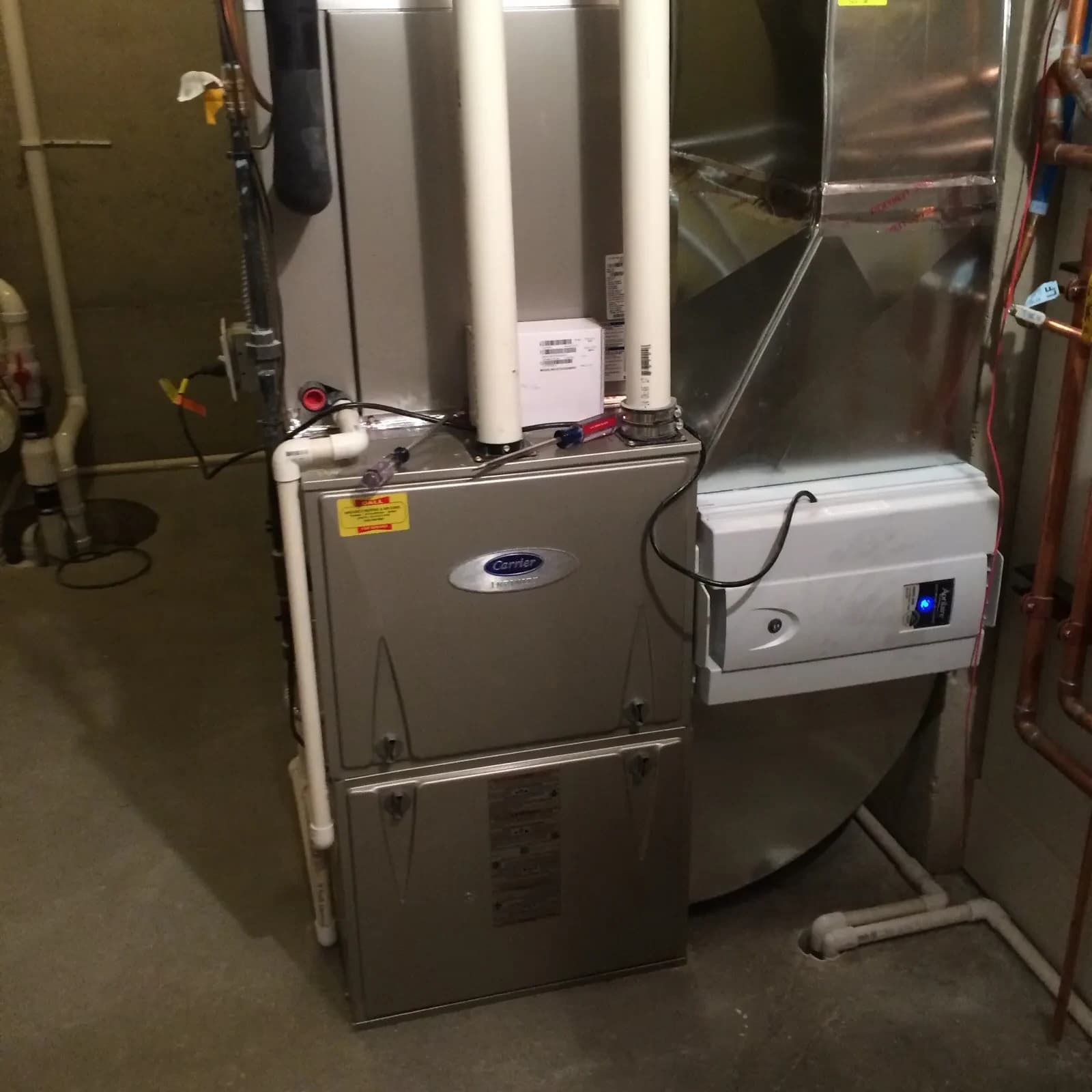A Carrier furnace and humidifier installed by Mazure's in a West Michigan home