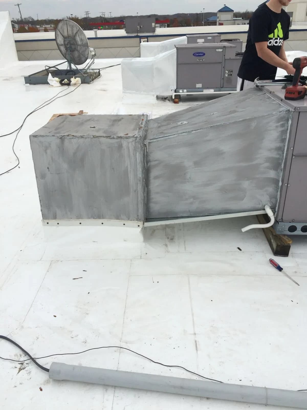 Commercial rooftop HVAC unit installation by Mazure's team