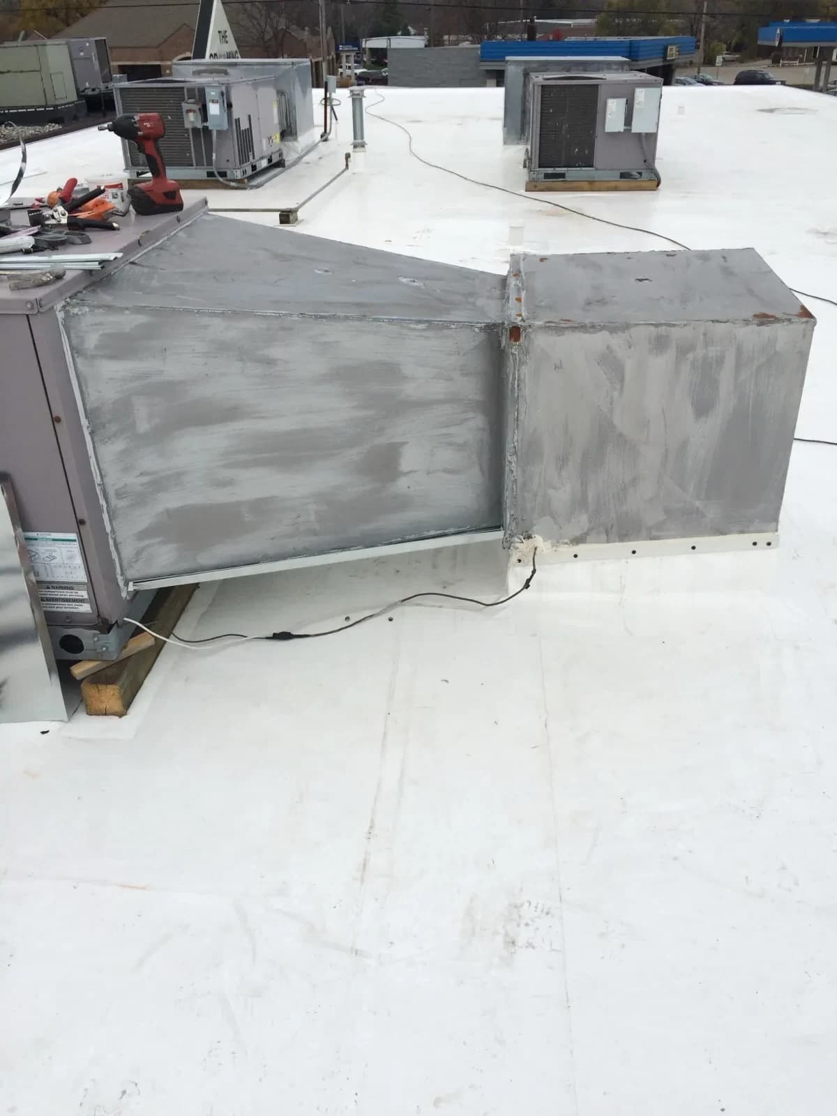 Commercial rooftop HVAC unit with ductwork