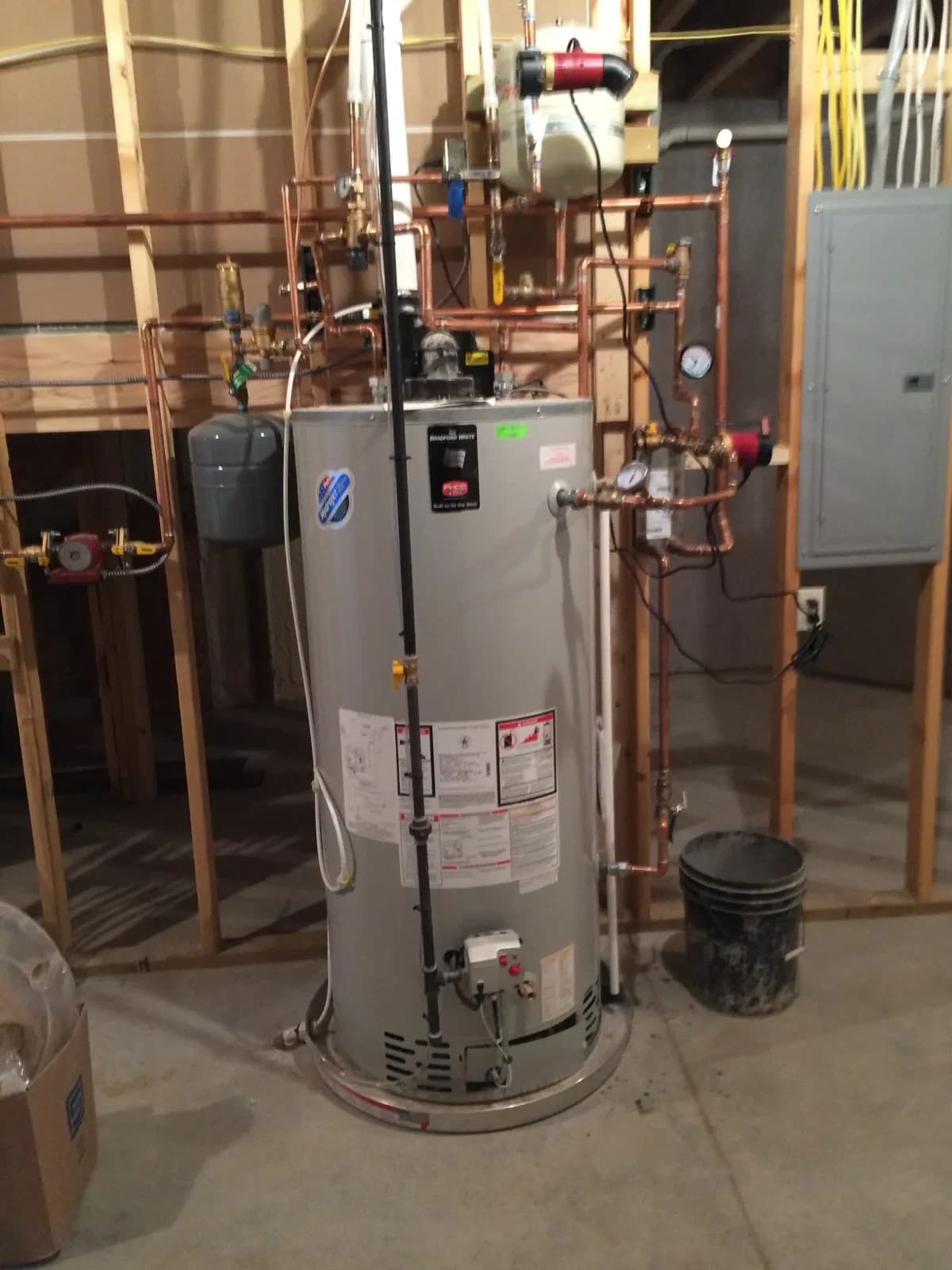 Commercial water heater with recirculation piping system