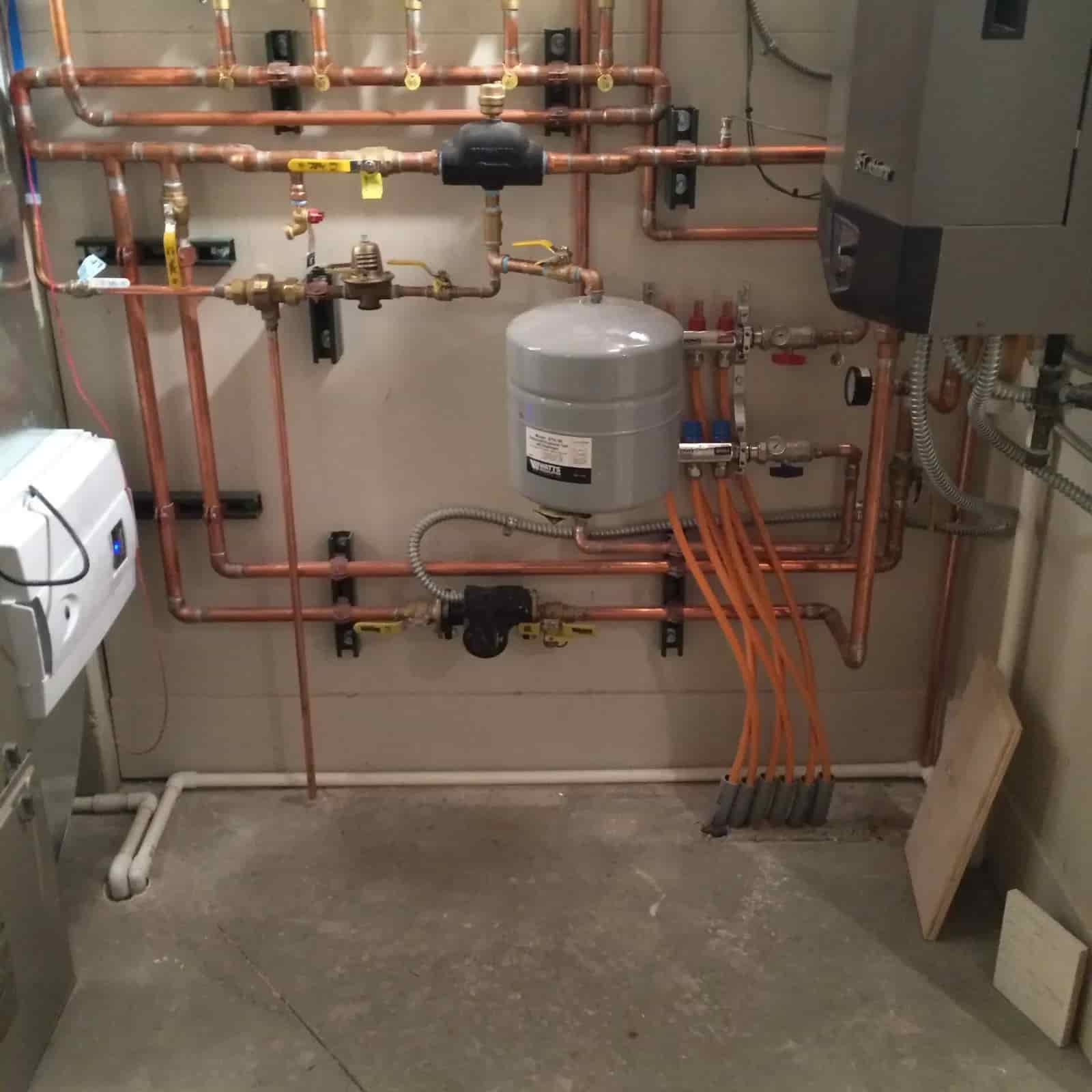 New boiler installation with hydronic piping by Mazure's